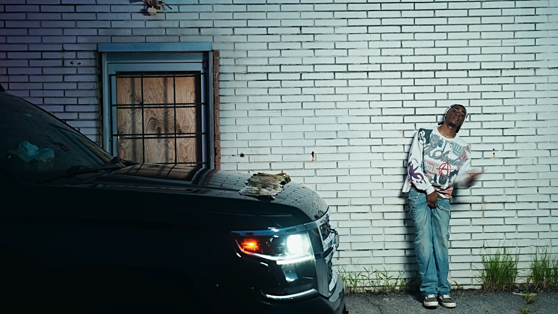 RW 5ive beside a car in Opelika